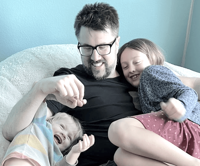 Kyle Kelley with his toddler and eldest daughter